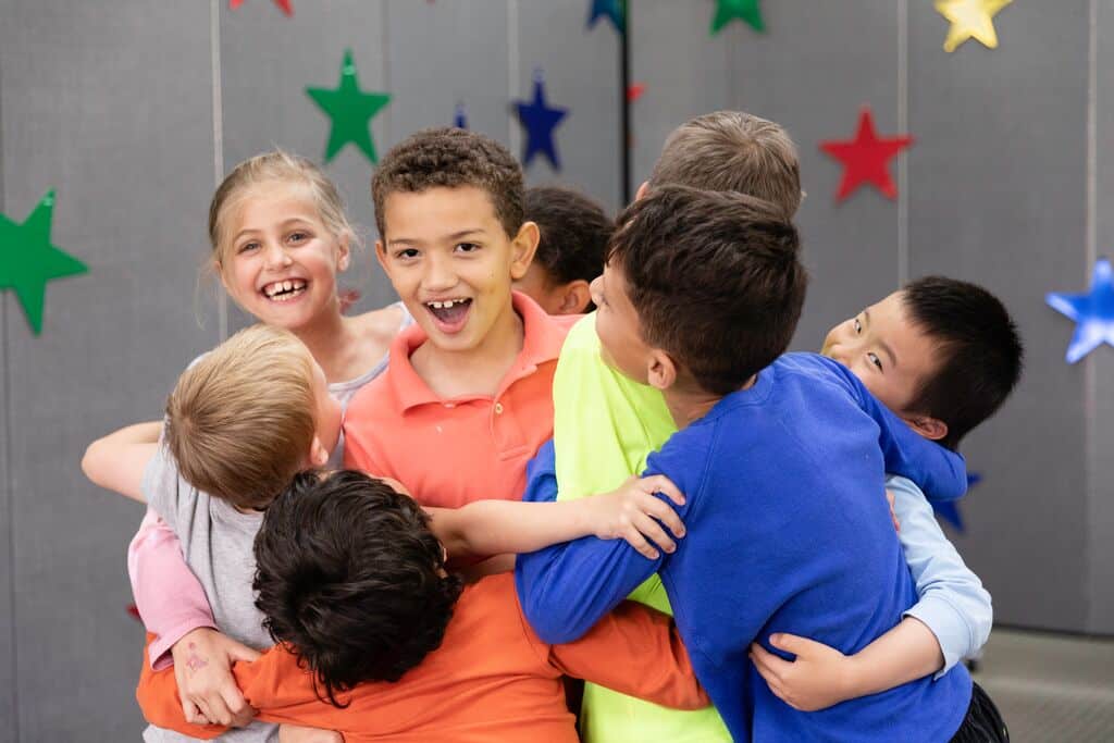 A group of GNCS students sharing a group hug