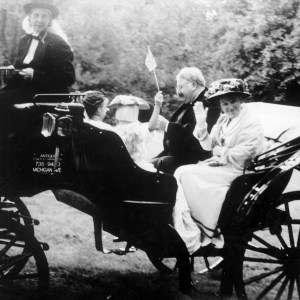 Attendees of a Glenview New Church Open House wave from a horse drawn carriage in the early 1900's